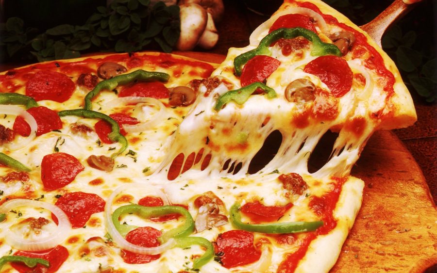 Top 4 Reasons That Will Make You Fall In Love With Pizza All Over Again